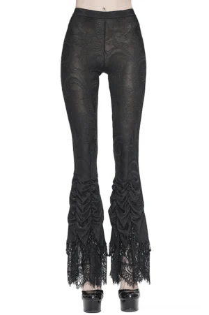 Black lace flared gothic trousers front view on model with platform pumps, showing damask lace hem detail