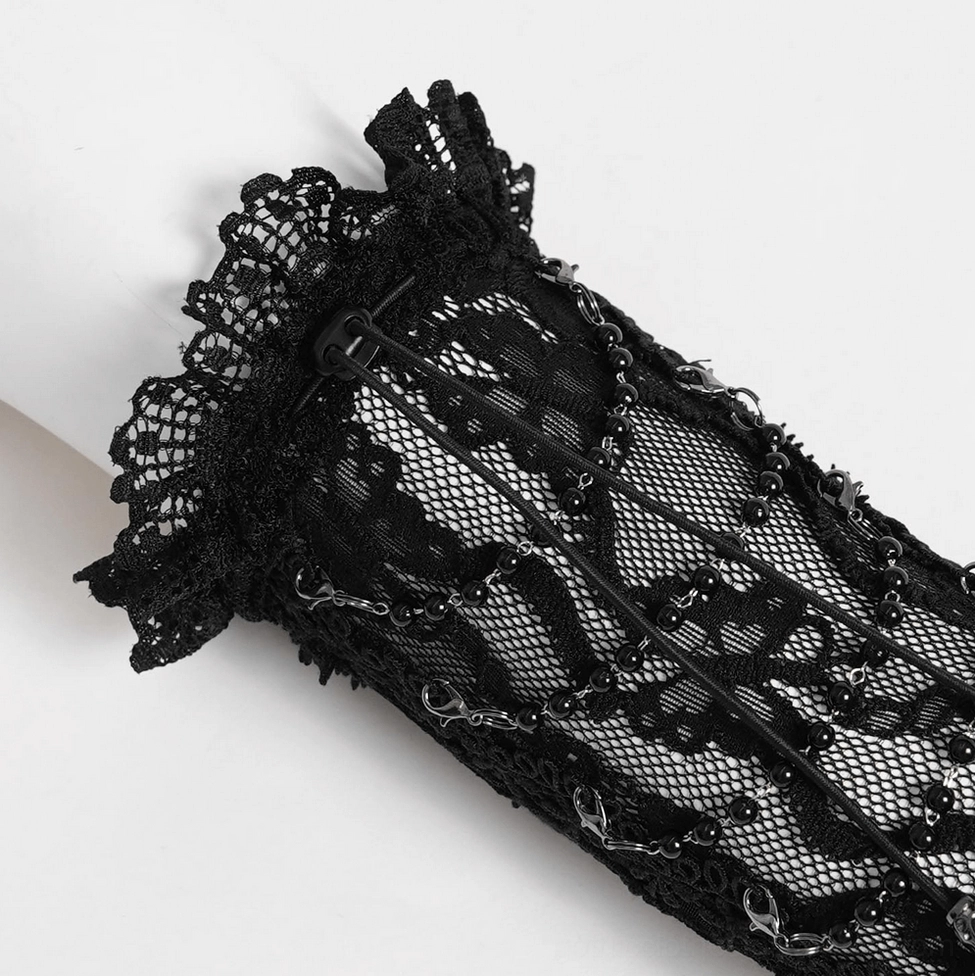 Gothic black lace fingerless gloves detailed close-up of lace pattern and chain embellishments