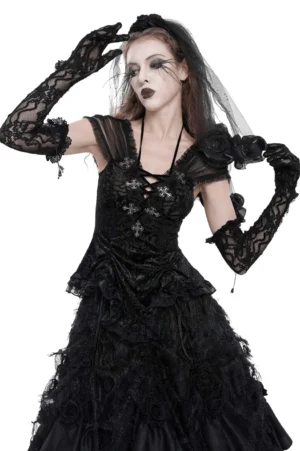 Black lace fingerless gothic gloves with chain details worn by female model, side profile view showcasing ruffled cuffs
