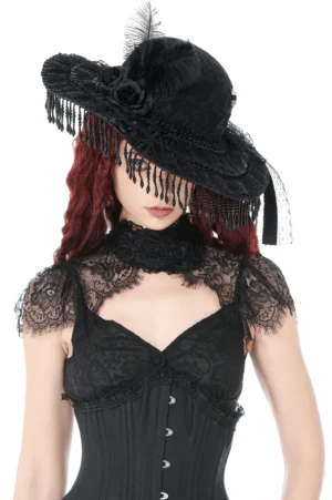 Victorian gothic black lace hat with beaded fringe and feather rose accent - front three-quarter view on model with red hair