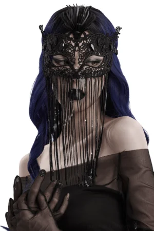 Black gothic lace masquerade mask with sequin tassels and 3D feather ornament worn by model, front close-up view