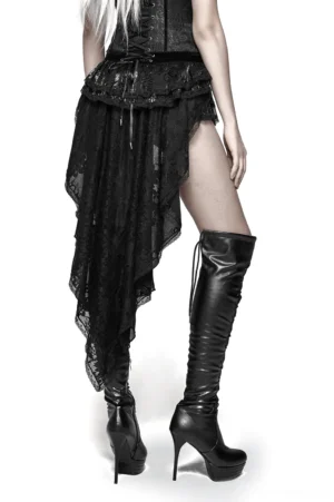 Black gothic lace shorts back view showing dramatic swallow tail asymmetrical hem and sheer lace overlay, worn with platform boots