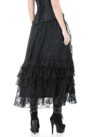 Black lace layered skirt rear view displaying tiered ruffled hem and fabric drape, styled with boots