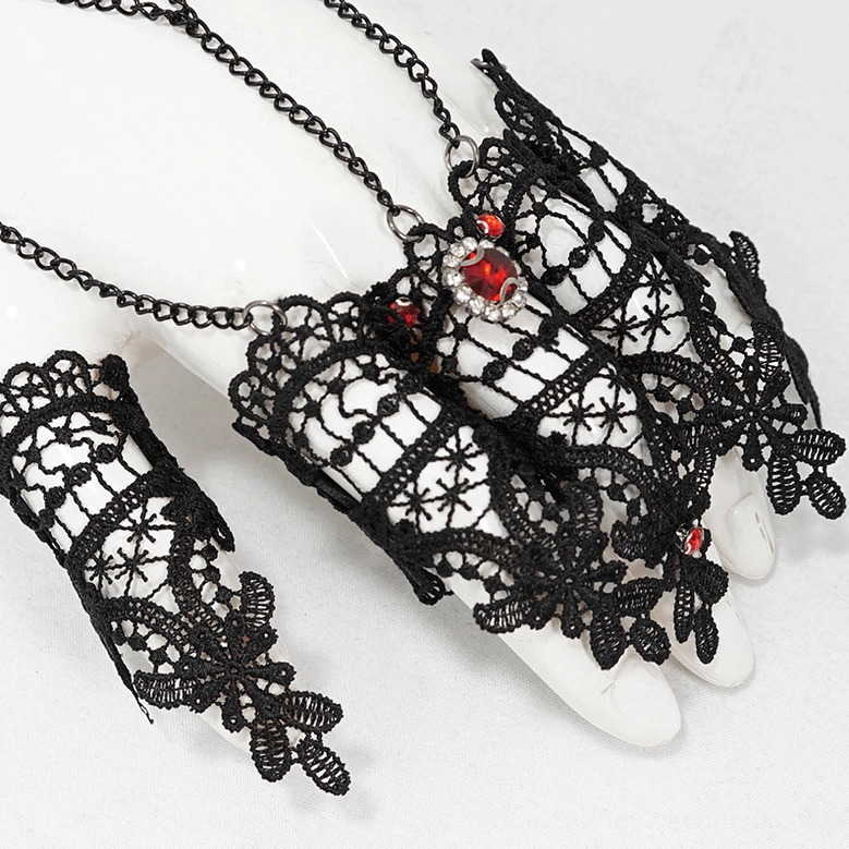 Gothic lace hand accessory close-up showing integrated finger sleeve and bracelet chain on white mannequin