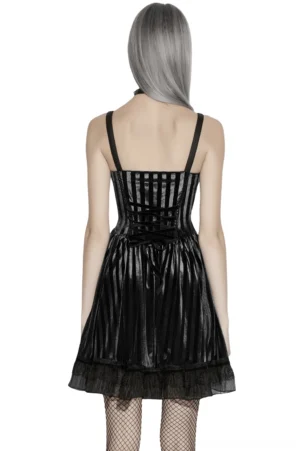 Black velvet striped gothic midi dress with lace-up corset back and fishnet stockings worn by model on white background, rear view