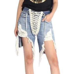 Female model wearing light blue distressed high-waist denim shorts with lace-up front closure and frayed details, front view