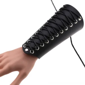 Gothic lace-up leather arm cuff on hand, side view showing black rope-chain lacing and metal eyelets detail