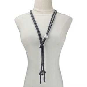 Black rubber gothic lariat necklace with silver pearl and metal screw adjusters displayed on dress form mannequin front view