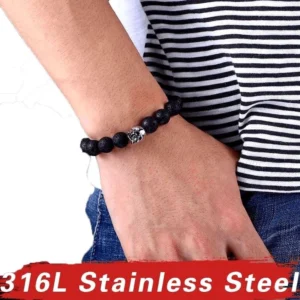 Unisex gothic lava stone skull bracelet worn on male wrist - side view showing fit and everyday wear potential