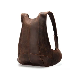 Dark brown genuine leather gothic backpack rear oblique view with multi-panel stitched construction and embossed detail