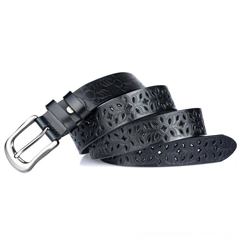 Stacked black hollow-carved leather belts displayed flat, showcasing the decorative floral cutout design and metal pin buckle