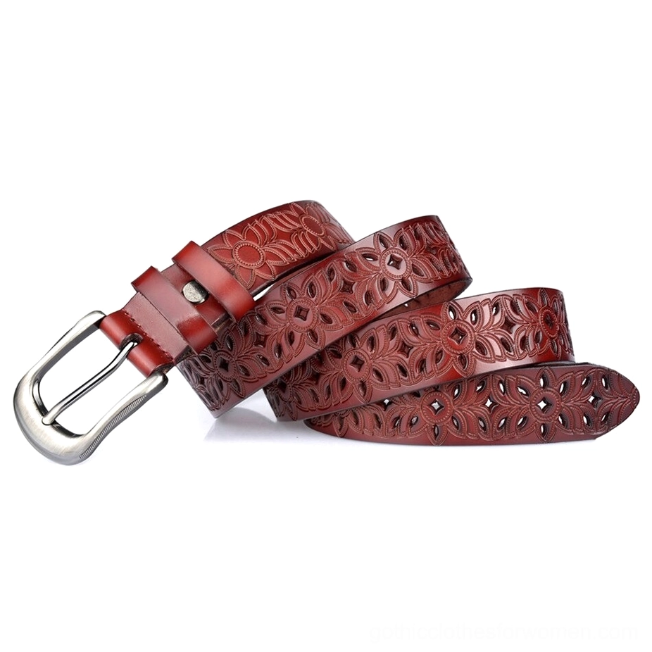 Dark red burgundy leather gothic belt rolled display showing the silver pin buckle and carved hollow floral details