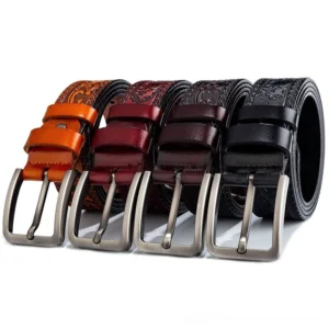 Collection of four gothic embossed men's leather belts in wine red, coffee brown, yellow-brown, and black with matching floral designs