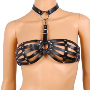 White mannequin torso displaying black leather bondage harness with strappy cage bra design, detachable neck O-ring strap, and metal hardware closure