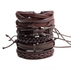 Brown leather gothic bracelet set stacked overhead view showing six-piece collection with mixed braided rope and solid leather designs, flat lay on white background
