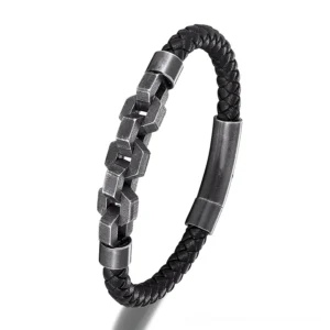 Two distinct styles of men's black leather gothic bracelets with gunmetal chain segments displayed flat lay, showing style variations