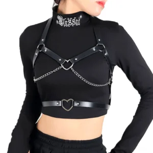 Gothic leather chest harness with silver chains and heart hardware, worn by woman in black turtleneck, front view