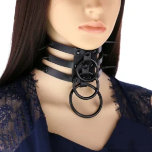 Black leather spike choker with metal ring pendant – frontal styling on model with long hair