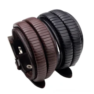 Gothic dual-tone leather cuff bracelet oblique side view showcasing black and brown genuine leather with leaf ornament details