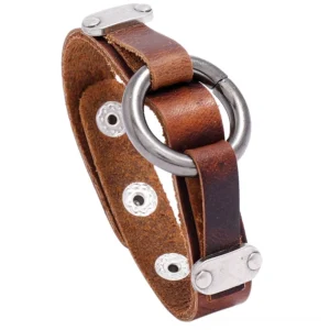 Distressed brown PU leather gothic cuff bracelet with antique silver O-ring and rivet snap fasteners, close-up front view showing detailed texture and hardware
