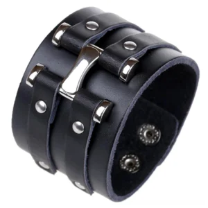 Wide black leather punk rock bracelet side profile, displaying stainless steel buckle and studded metal accents with adjustable snap closures
