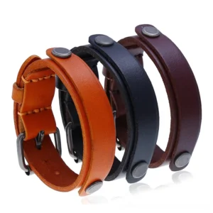 Three-piece adjustable gothic leather cuff bracelet set in black, brown, and tan with antique silver-plated metal hardware and rivets