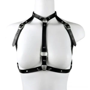 Adjustable black PU leather body cage harness displayed on mannequin torso, front view showing multiple metal rings, riveted straps, and buckle closure