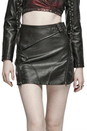 Black faux leather gothic mini skirt front view on model with braids, showing matte leather finish and diagonal stitching details