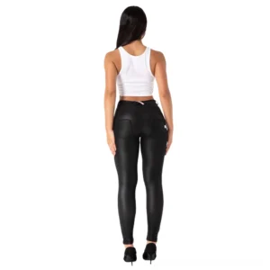 Model wearing black leather gothic trousers from back view, displaying high-waisted cut and back pocket button details