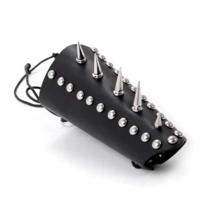 Black leather spiked wrist guard with stainless steel round and spike rivets, lace-up fastening, 3/4 side view on white background