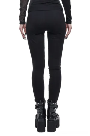 Asymmetrical punk gothic leggings rear full view showing fitted silhouette with dark prints, styled with platform combat boots