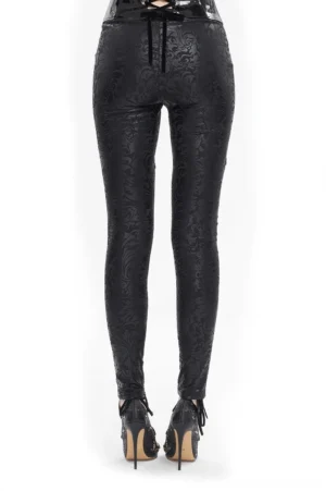 Black gothic leggings with lace-up back closure and embossed leather-like texture, rear view on model