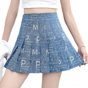 Cobalt blue letter print pleated denim mini skirt front view on model, showing all-over typography and empire waistline