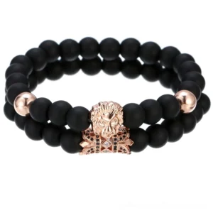 Rose gold gothic lion head beaded bracelet featuring double-strand construction, dark stone beads, rose gold lion charm with crown embellishment, and sparkling zirconia details