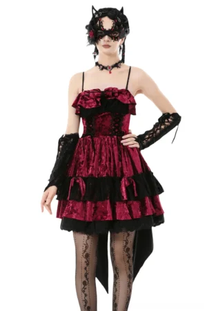 Front three-quarter view of burgundy crushed velvet gothic Lolita mini dress with black lace corset detailing and ruffled neckline, worn on model with cat ear mask