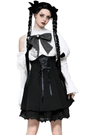 Black and white gothic lolita dress front view with corset waist and lace puff sleeves on model with twin braids