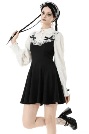 Black and white gothic lolita dress front three-quarter view with twin braids model, featuring lace collar, puff sleeves, and contrast black ribbons