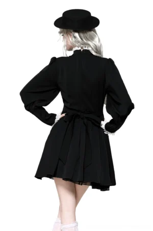 Gothic Lolita black and white dress back view showing pleated skirt, waist tie sash, and lace-trimmed cuffs on model