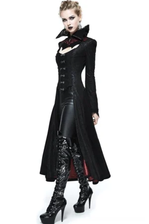 Black and red embossed gothic long coat with high spiked collar, side three-quarter view showing burgundy satin lining