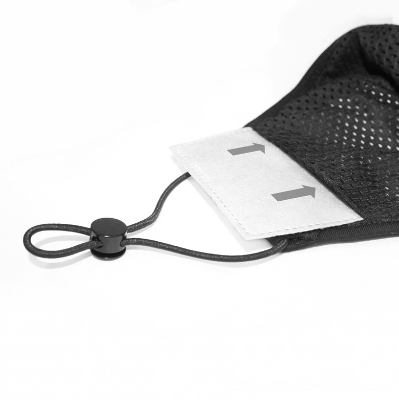 Close-up side view of gothic punk face mask showing black mesh inner layer and replaceable filter pad insert on white background