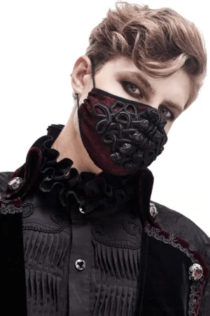Male model wearing wine red gothic mask with adjustable straps paired with gothic ruffled collar formal shirt