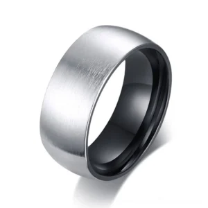 Minimalist matte stainless steel gothic ring with black inner plating, close-up oblique view showing brushed metallic finish