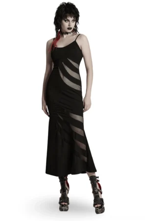 Front three-quarter view of black asymmetric claw slash mesh gothic slip dress with spaghetti straps and fishtail hem on model