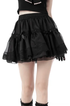 Black gothic mini skirt with tiered tulle and satin bow details, front view on model