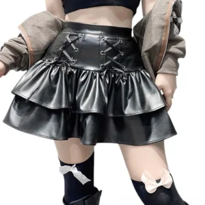 Black PU leather high-waisted ruffle mini skirt front view with metal eyelet lace-up detail and double-tiered ruffled hem