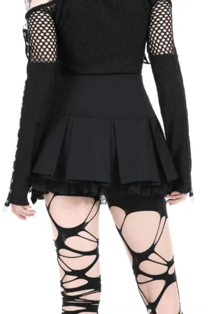 High-waisted black pleated mini skirt rear view showing lace underskirt hem and pleated structure