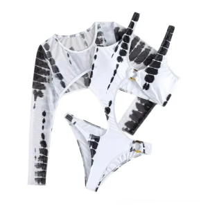 Flat lay top-down view of complete tie-dye monokini swimsuit set showing full design pattern and O-ring hardware details