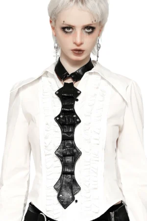 Black faux leather gothic neck harness with metal rivets worn by alt model, frontal studio view showcasing structured panels and clasp detail