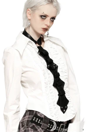 Black gothic faux leather harness side profile showing decorative draped panels and rivet detailing on model with platinum hair