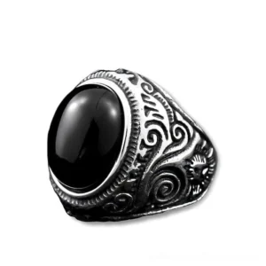 Gothic onyx statement ring in silver finish featuring polished black oval stone with ornate band details